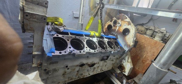 Marine diesel engine block with exposed cylinder bores during yacht engine overhaul