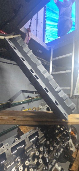 Marine diesel cylinder head installation inside yacht engine room