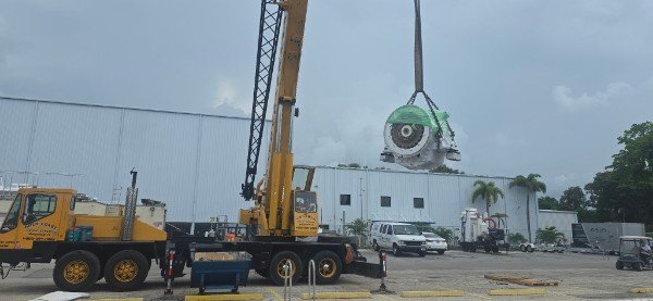 Marine engine lift with crane support at South Florida service yard